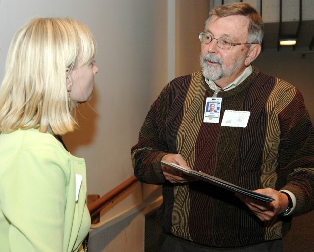 Carolyn Zerkle, left, principal deputy associate director for Administration (ADA), speaks with Laboratory Director Bob Kuckuck on Monday prior to an all-employee meeting on child care in the Physics Building Auditorium at Technical Area 3.