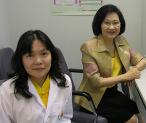 Shown in her Bangkok office, CRI Vice President for Research Mathuros Ruchirawat, Ph.D., posed at her computer as colleague Panida Navasumrit, Ph.D., an investigator in the CRI Laboratory of Environmental Toxicology, joined her for this photograph.