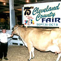 Cameron Lutz with Senior and Grand Champion Jersey Female, October 1999