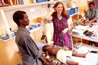 Dr. Taylor with a patient in Malawi