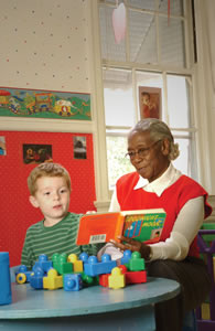 SCSEP participant contributes to the reading experience of daycare children.  Copyright Mark DeLong 2005