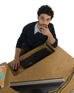 Image of a research assistant at his desk