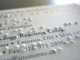ATRC business card with braille impressions