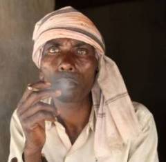 Indian man smoking a bidi