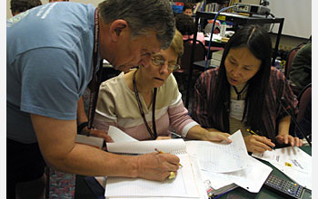 Photo of three teachers sharing strategies for student success