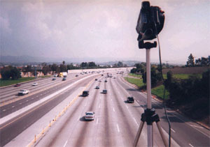 Photo of  a video camera setup on a highway 