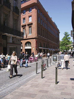 This city-center street in Toulouse, France, is typical of good practices in Europe. It is designed for pedestrians just as much as for vehicles. Photo: C.G.B. Mitchell.
