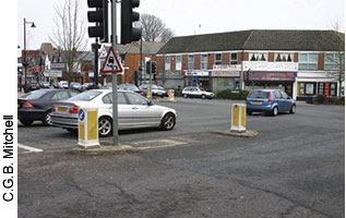 This photo from Britain shows a pedestrian refuge at a major lightcontrolled intersection.