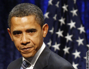 Close-up of Barack Obama, U.S. flag behind him (AP Images)