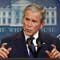 President Bush at microphone (AP Images)