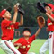 Children playing baseball (AP Images)