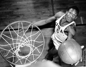 Bill Russell performing a layup (AP Images) 