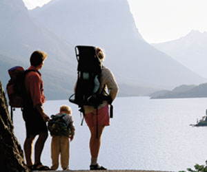 photo: family enjoying view of mountain lake