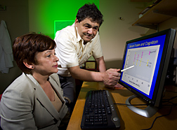 Photo: Martha Morris and Jacob Selhub examine computer display of data. Link to photo information