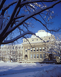 Sibley Hall with its white dome after a winter snowstorm