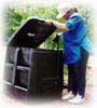 Managing Waste Safely: A lady throwing away trash