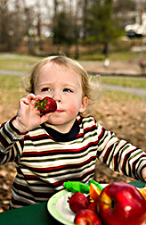 Photo: 20-month old boy enjoys a healthful snack. Link to photo information