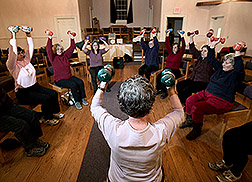 Strong Living Program coordinator leads an exercise class. Link to photo information