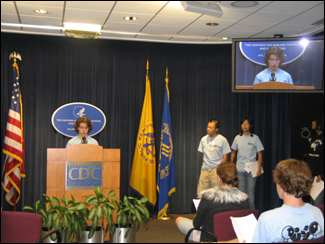 image of boy speaking at podem