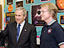 President Bush talks with a man in a classroom