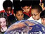 Several children gathered around and looking at a large globe