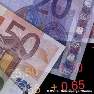 Photo: Photo collage of Euro bills and stock listings