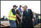 President George W. Bush meets and speaks with port workers following his remarks on U.S. trade policy Tuesday, March 18, 2008, at the Blount Island Marine Terminal in Jacksonville, Fla. White House photo by Chris Greenberg