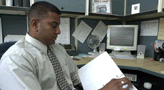 A office worker at his cubicle