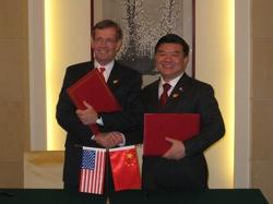 December 4, 2008 - U.S. Secretary of Health and Human Services (HHS) Mike Leavitt and his counterpart from the People's Republic of China, the Honorable Chen Zhu, M.D., after they renewed for another five years the Protocol on U.S.-China Cooperation in the Science and Technology of Medicine and Public Health, the framework document that governs work on health between the two nations. The ceremony took place on the sidelines of the fifth session under the United States-China Strategic Economic Dialogue, in Beijing, capital of the People's Republic of China.
