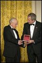 President George W. Bush thanks David Herbert Donald for his scholarship in preserving the legacy of President Abraham Lincoln’s life while at a dinner in honor of the Ford’s Theatre Abraham Lincoln Bicentennial Celebration Sunday, Feb. 11, 2007, in the East Room. "As we approach the bicentennial of President Lincoln’s birth," said President Bush, "his words and principles continue to guide our nation." White House photo by Paul Morse