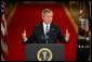 President George W. Bush responds to questions during a prime time press conference in the East Room of the White House on April 13, 2004.  White House photo by Paul Morse