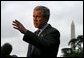 Departing the White House via Marine One, President George W. Bush talks with the media on the South Lawn Friday, May 16, 2003.  White House photo by Paul Morse