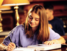 Photograph of Student working on a paper