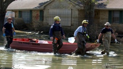 Photograph of Rescue Workers in Flooded Neighborhood