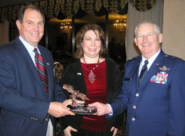 <strong>BLM Jackson office: </strong><em>From left, Jackson Field Office Manager Bruce Dawson received the  Mississippi Employer Support of the Guard and Reserve’s highest honor, the Pro  Patria Award, from Mississippi’s Adjutant Major General Harold Cross on Nov.  18, 2005. At center, Michelle Barrett (Bruce’s wife) joined the award  presentation.