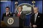 President George W. Bush holds a press briefing at the White House Friday, Feb. 6, 2004. "Today, by executive order, I am creating an independent commission, chaired by Governor and former Senator Chuck Robb (left), Judge Laurence Silberman (right), to look at American intelligence capabilities, especially our intelligence about weapons of mass destruction," said the President.   White House photo by Paul Morse