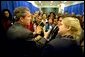 President George W. Bush meets with participants of the women's entrepreneurship in the 21st Century Summit at the Ronald Reagan Building and International Trade Center, Washington, D.C., Tuesday, March 19. During his visit, the President unveiled plans to help small businesses across the country. "You can dream big dreams in America, and my job as the President is to make sure that if you've got a good idea, you can realize those dreams," said the President. White House photo by Paul Morse.