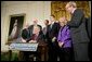 President George W. Bush signs S. 5, the Class Action Fairness Act of 2005, during a ceremony in the East Room, Friday, Feb. 18, 2005.  White House photo by Eric Draper