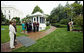 President George W. Bush and Mrs. Laura Bush watch their daughter Jenna Hager and son-in-law Henry Hager plant a Cherokee Princess Dogwood during a commemorative tree planting ceremony Saturday, Sept. 27, 2008, on the South Lawn of the White House.  White House photo by Eric Draper