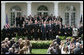 President George W. Bush welcomes members the U. S. Naval Academy football team to the White House, where he presented the Commander-In-Chief trophy to the team in ceremonies in the Rose Garden at the White House, Monday, April 2, 2007. White House photo by Joyce Boghosian