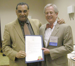 Wilmington Mayor James M. Baker, left, presents a proclamation in appreciation of LSC and its Delaware grantee to LSC Board Chairman Frank B. Strickland.