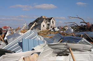 Tornado-damaged house surrounded by rubble in Lafayette, Tenn. Image courtesy Federal Emergency Management Agency.