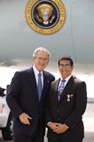 President George W. Bush presented the President's Volunteer Service Award to Joey Rizzolo Jr., upon arrival at John F. Kennedy Airport in New York City on Monday, September 22, 2008.  Rizzolo, 13 of Paramus, New Jersey, is the organizer of the Paramus Freedom Walk and a volunteer with Operation Goody Bag.  To thank them for making a difference in the lives of others, President Bush honors a local volunteer when he travels throughout the United States.  He has met with more than 650 volunteers, like Rizzolo, since March 2002.