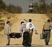 Evidence Response Team at work.  Below the photo display is a blue background with with people that work on the Evidence Response Team. This photo is faded in the background with white links on top of the image.