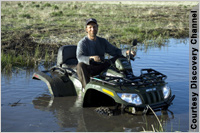Rowe on all-terrain vehicle, in a pond (Discovery Channel)