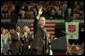 President George W. Bush waves during his visit to the Knoxville Civic Center in Knoxville, Tenn., Monday, April 8. Listing several specific ways Americans can volunteer, the president spoke about the value and need of community service. "And so for those of you out there who are interested in participating, I want you to call up this number, 1-877-USA-CORPS, or to dial up on the Internet, www.citizencorps.gov. This is a way where you can help America," said President Bush. White House photo by Paul Morse.