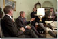 Addressing the media, President George W. Bush meets with Norwegian Prime Minister Kjell Magne Bondevik in the Oval Office of the White House, December 5, 2001. "We won't forget what took place," said President Bush, referring to the Sept. 11 terrorist attacks. "And we will bring them to justice." White House photo by Paul Morse.