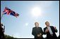 President George W. Bush answers questions from reporters following the arrival of British Prime Minister Tony Blair at Camp David, Saturday, Sept. 7, 2002.  