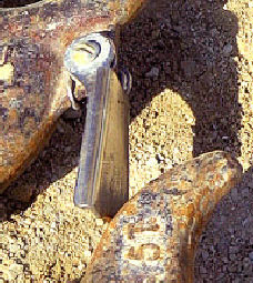 Photo 7 -- Close-up of a typical spring-loaded latch on a hook.