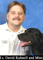 Photograph of Lt. David Kuhnell and Mint (dog).